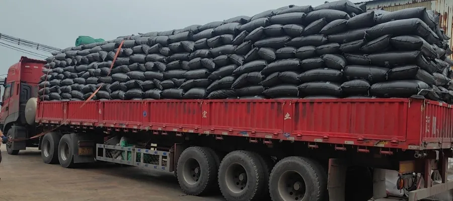 28 toneladas de carbon activo de cascara de coco cargadas en camiones